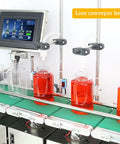 Double Head Automatic Bottle Filler Machine With Conveyor Belt, operational view filling red liquid into bottles.