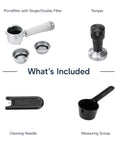 Compact Espresso And Cold Brew Coffee Maker Featuring Built In Milk Frother Wand accessories: portafilter, tamper, cleaning needle, scoop.