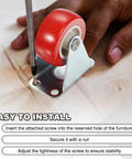 1.5 Inch Red Swivel Caster Wheels Set being installed on wood surface with screwdriver, 8 Pack PVC Plate Casters With 66 Lb Capacity Each