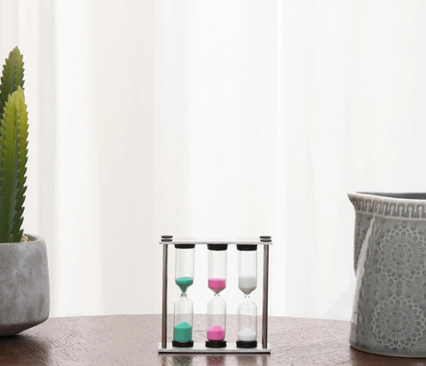 Go To Desk Timer With Brushed Stainless Steel Frame Three In One 3 4 5 Minute Kitchen Timers on a wooden table, multicolor sand