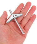 32 Piece Stainless Steel Toggle Bolts And Drywall Anchors Kit With Wing Nuts held in hand for size reference