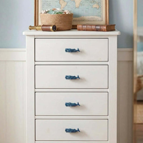 White dresser with Sperm Whale Shaped Cabinet Knobs 4 Piece Set In Vintage Ocean Blue Zinc Alloy for kitchen cupboard doors.