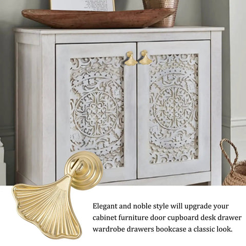 Six Piece Golden Ginkgo Leaf Cabinet Knobs, Smooth Drop Pendant Pull Handle Hardware For Drawers And Wardrobes displayed on cabinet.