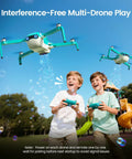 Two kids playing with Bubble Drone For Kids And Beginners With Headless Mode, Auto Rotation, Dual Batteries at a park, bubbles fill the air.