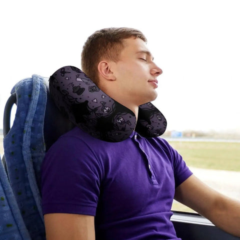 Man using Purple Black Goth Spooky U Shaped Travel Pillow For Neck Support on a bus, showing memory foam comfort and portability