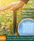Installing solar powered mole repellent stake in garden with close-up of solar panel, for lawns and gardens ultrasonic gopher.