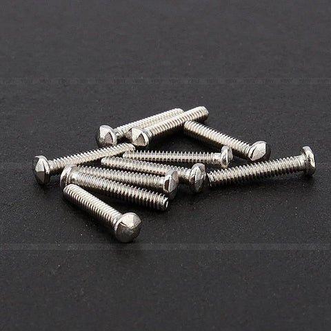 Precision Crafted Micro Stainless Steel Screws For Professional Watch Repairs And Antique Clock Restoration Hella Durable Tiny Watchmaker Parts Collection on black surface.