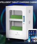Premium White Aluminum Charging Cabinet Featuring Secure Locking Drawers For Thirty Laptops Tablets And Phones with green device holders.