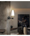 Straight Up Modern Led Wall Sconce With Soft Glowing Acrylic Shade lights up hallway with sleek design and warm light.