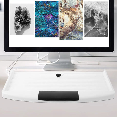 Under Desk Keyboard Tray With Smooth Sliding Drawer And Ergonomic Mount Rock Solid Polypropylene Design Keeps Comfy Typing Posture And Frees Up Serious Office Desk Space For Hassle Free Install shown under monitor.