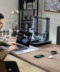 Two Piece Desk Grommet Set in Black ABS Plastic for Cable Management on office desk with wires and devices