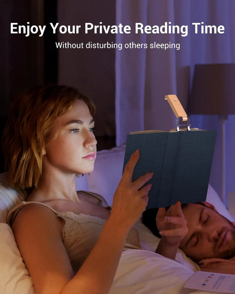 Woman using USB Rechargeable Clip On Reading Light With Amber And Warm White Modes; eye friendly dimmer in bed, peach fuzz color.