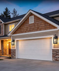 Top Shelves Two Pack Of 17 Inch Exterior Wall Sconces For House Facades showing matte black build mounted beside garage door.