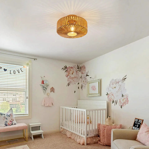 Boho Rattan Ceiling Light Fixture Hand Woven Cage Shade Semi Flush Mount in nursery with cozy warm glow and floral decor.
