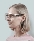 Person wearing Over Eyeglasses Safety Goggles With Anti Fog Lenses And Scratch Resistant HD Clarity ANSI Z87 Approved Protective Eyewear
