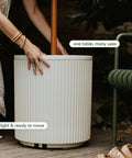 Patio Must Have Weatherproof Umbrella Side Table With Hole Durable Plastic Stone Combo Easy Assembly beside lounge chair