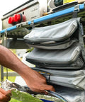 Hanging Organizer For Outdoor FlexRail Camp And Cook Table, Durable Weather Resistant Pocketed Storage, shown attached to a table.
