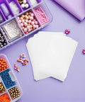 EPE Pearl Cotton Foam Pouches For Moving And Packing Hassle Free Quick Wrap Protective Sleeves For Dishes And Mugs Lightweight Cushioning With Impact Resistance 200 Pack For Safe Transit And Storage, white sleeves flat lay