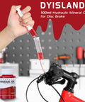 All Hydraulic Disc Brake Bleed Kit With Mineral Oil Gloves Syringes And Installation Tools For Quick Pro Grade Bleed Of Your Hydraulic Brakes On Any Caliper, showing red mineral oil being injected into a brake system.