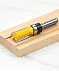 4 Piece Flush Trim Router Bit Set With Top Bearing Carbide Cutters For template routing, showcasing a 1/2 inch bit on wood.