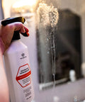 Person applying Shower Door Glass Protectant That Makes Water Bead Off, A Water Repellent Sealant For Glass Doors on shower door.