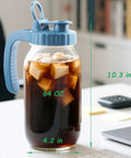 Two Pack 64 Oz Wide Mouth Pitchers With Stainless Steel Filters holding iced coffee, blue lid on desk, size labeled