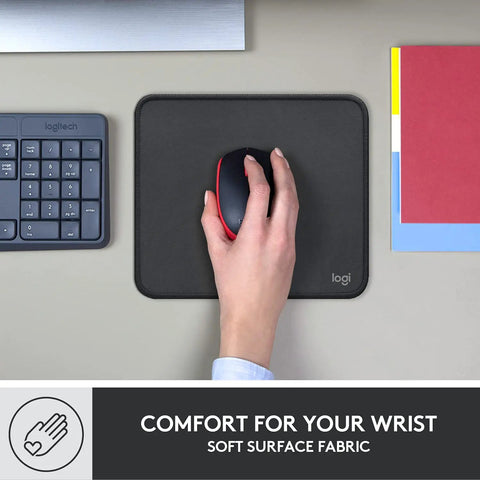 Hand using mouse on Studio Series Mouse Pad With Anti Slip Rubber Base, Spill Resistant Surface, Portable Desk Mat In Graphite