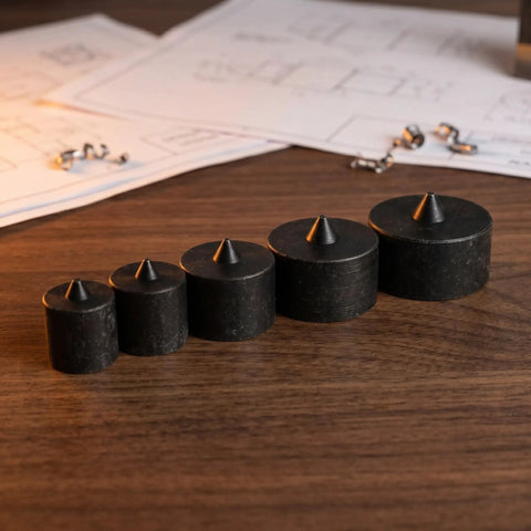 Heavy Duty Industrial Shaft End Cap Protectors 6 Piece Set prevents loosening and damage, displaying 5 black metal caps on wooden surface.