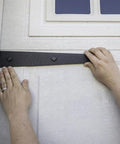 Heavy Duty Magnetic Garage Door Hardware Kit 6 Piece Set installation with steel dampers on white garage door.