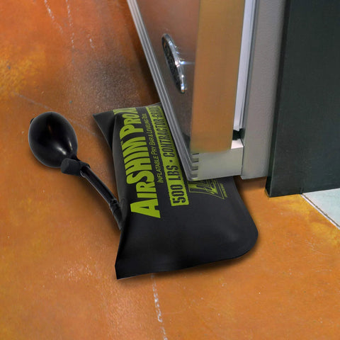 Air Shim Pro inflatable pry bar and leveling tool with hand pump; black storage bag, 500 lb capacity.