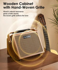 Crush20 Acoustic Guitar Amp With Reverb And 20W Power, wooden cabinet with acoustic guitar on a wooden surface