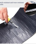 Heavy Duty Waterproof Roofing Tape With Flexible Butyl Asphalt And Thick Aluminum Foil for cutting with knife in hand.