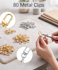 Eighty Piece Swivel Lobster Clasps In Shiny Gold And Silver Finishes slick hardware for jewelry making and crafts on workspace.