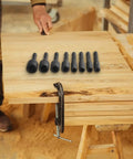Beefy Tap Socket Adapter Set For Screw Taps With Quarter Inch Hex Shank Extension Bar on a wooden workbench