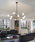 Modern Sputnik Chandelier Ceiling Light With 12 Lights In Gold And Black, Adjustable Height Up To 53.8 Inches in living room setting