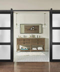 Knockout Double Barn Doors Featuring Frosted Glass Panels And A Slick Matte Black Finish Full Hardware Kit Included For Hassle Free Installation In Chic Living Rooms Or Primary Bedrooms.