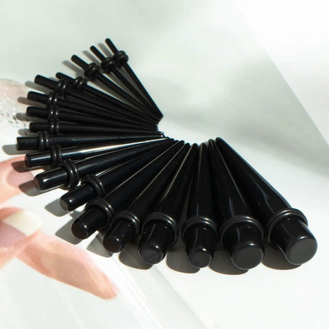 Starter Pack For Ear Stretching 50 Piece Kit With 14G To 00G Acrylic Tapers shown in circular arrangement