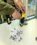 Person using a drill with Carbon Steel Binding Screws And Scrapbook Post Fasteners For Photo Albums And Documents Silver Finish.
