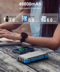 Massive 49800mAh Solar Power Bank With Wireless Charging on table, showing charging capabilities for phones and tablets