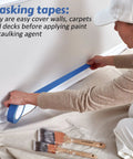 Person using blue painter's tape along wall with brushes nearby, Blue Painter Tape Bulk Pack 20 Rolls 1 Inch By 55 Yards Masking Tape