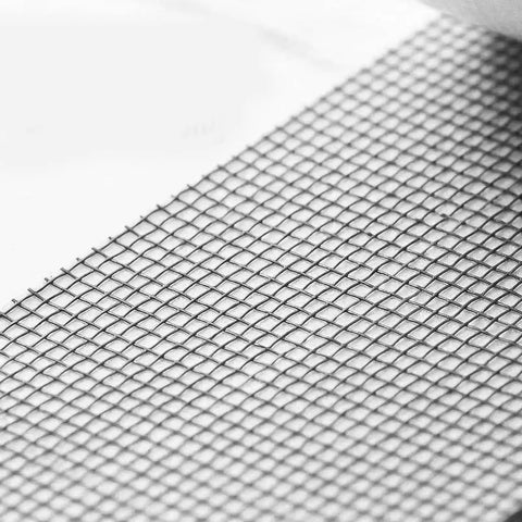 Close-up of fine mesh window screen repair tape, self adhesive patch for quick hole fix, durable polyurethane material, black screen repair.
