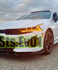 Front view of a white Kia K5 with Front Bumper Lip Splitter Spoiler Kit Bolt On For Kia K5 2021 2026 All Models Ex Lx Lxs GT GT Line Gloss Black 3 Piece Air Dam Chin Lip Underbody Aero Enhancement installed.