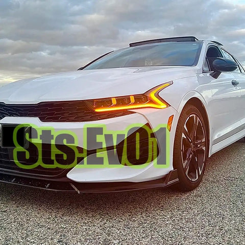 Front view of a white Kia K5 with Front Bumper Lip Splitter Spoiler Kit Bolt On For Kia K5 2021 2026 All Models Ex Lx Lxs GT GT Line Gloss Black 3 Piece Air Dam Chin Lip Underbody Aero Enhancement installed.