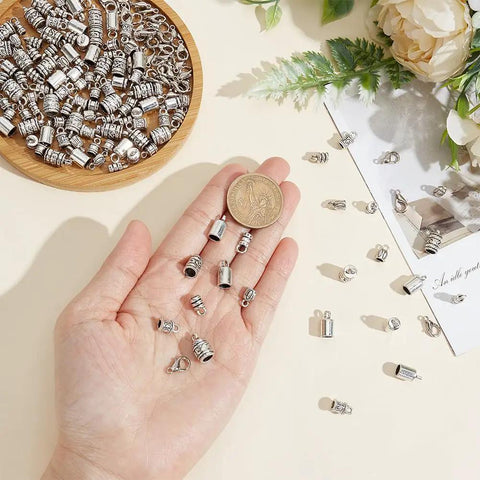 Rock Your Custom Jewelry With This Ultimate 270 Piece Silver Alloy Crafting Kit Featuring 9 Styles Cord End Caps Lobster Clasps Jump Rings And Crimp Beads For Stunning Bracelet Necklace Paracord DIY Creations That Go Viral Anywhere, silver cord findings in hand
