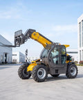 Heavy Duty Four Wheel Drive Telescopic Handler Forklift With Smart Cooling And Butter Smooth Transmission For Tough Industrial Jobs Auto Leveling Electro Hydraulic Telehandler Machine in action outdoors.