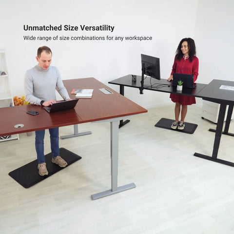 Electric Height Adjustable L Shaped Standing Desk 70 X 55 Inch Corner Home Office Workstation in use with two people.