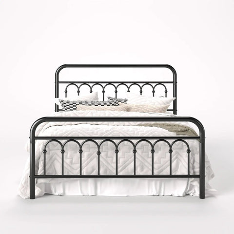 Rock Solid Queen Size Metal Platform Bed Frame With Victorian Scrollwork Headboard in black, showcasing a cozy bedding arrangement.