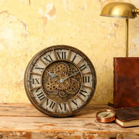 18 Inch Moving Gears Wall Clock Oversized Industrial Steampunk Design With Antique Oil Rubbed Bronze Finish displays gear face on wooden tabletop.