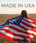 Person in field with USA flag draped over shoulders, text 'MADE IN USA' above