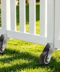 Four Pack Of One Point Five Inch Rigid Caster Wheels With Rock Hard Stainless Brackets And Smooth As Butter Rubber Tires for utility cart on grass.